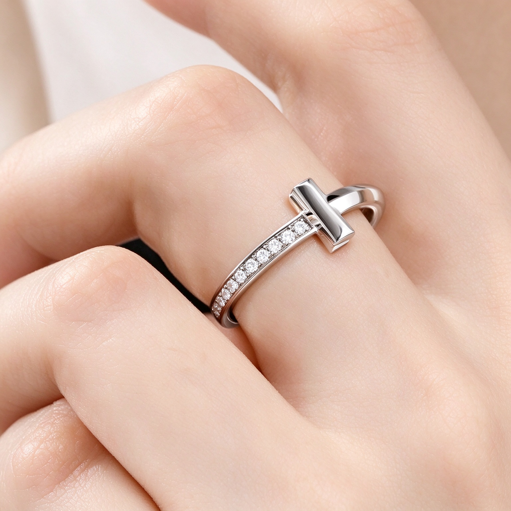Tiffany T Diamond platinum band ring—featuring the iconic T motif.