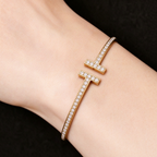 Tiffany T T1 Narrow Hinged Bangle in Yellow Gold—Modern Elegance and the Iconic Spirit of New York
