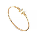 Tiffany T Collection Yellow Gold Double T Bracelet—Iconic Double T motif and timeless American luxury.
