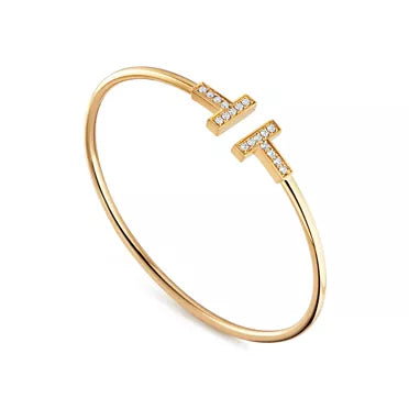 Tiffany T Collection Yellow Gold Double T Bracelet—Iconic Double T motif and timeless American luxury.