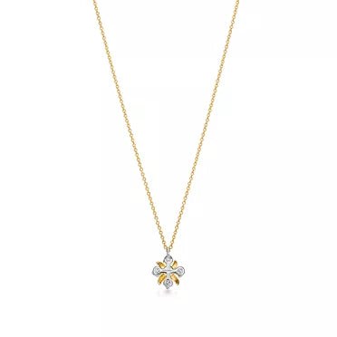 Tiffany & Co. Schlumberger Sixteen Stone X pendant necklace in yellow gold.