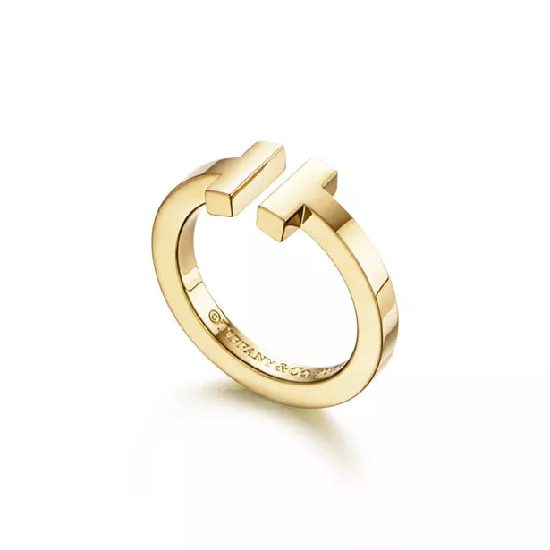 Tiffany T Collection Gold Single-Row Ring — A luxury unisex ring featuring the iconic T-shaped motif, blending classic and modern styles.