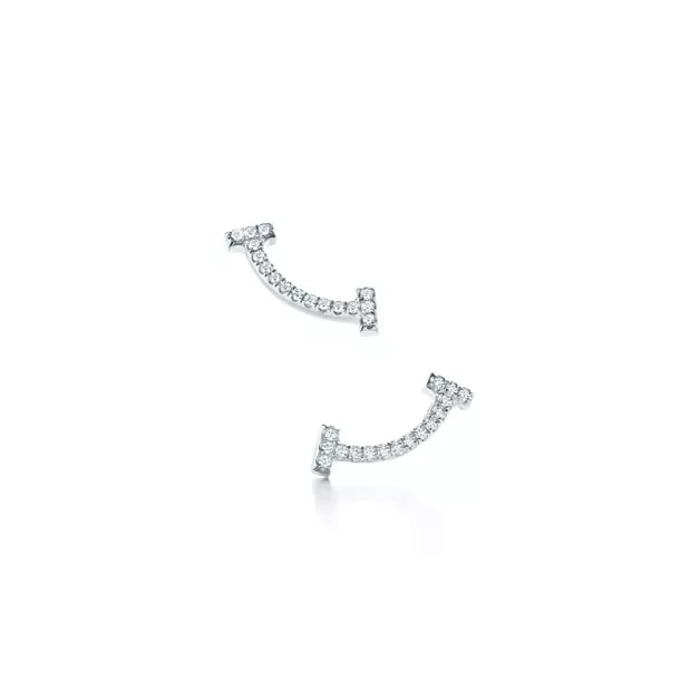 Tiffany T Smile earrings, yellow gold | Luxurious curved stud earrings, women's fine jewelry