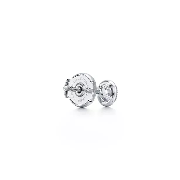 Tiffany Soleste Platinum Earrings—Iconic round brilliant-cut halo stud earrings | Luxury jewelry radiating a double dose of brilliance.