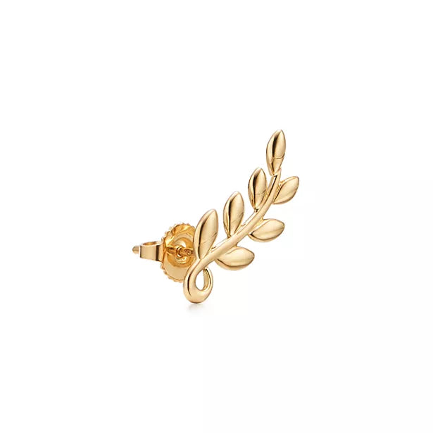 Tiffany & Co. Paloma Picasso Olive Leaf earrings in yellow gold—leaf-shaped stud earrings inspired by nature—women's fine jewelry.