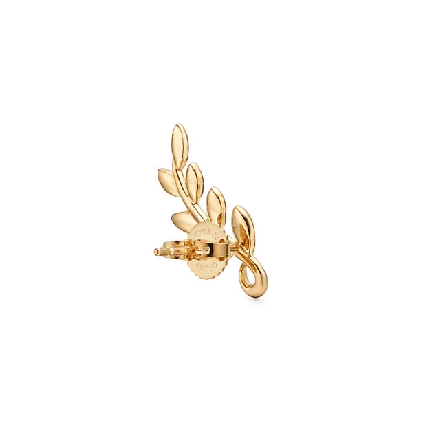 Tiffany & Co. Paloma Picasso Olive Leaf earrings in yellow gold—leaf-shaped stud earrings inspired by nature—women's fine jewelry.