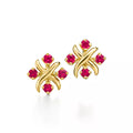 Tiffany Schlumberger gold stud earrings—iconic "X" motif crossover button-style studs.