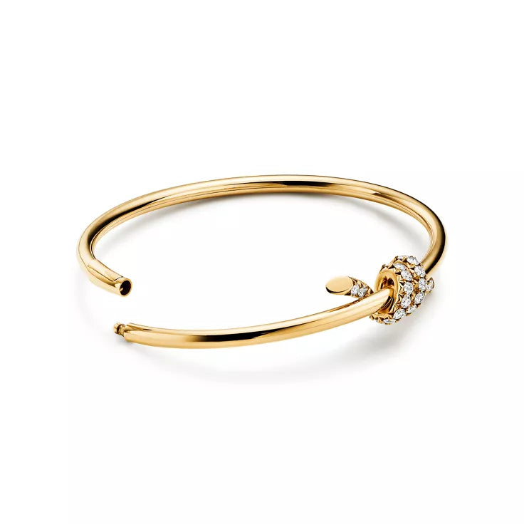 Tiffany T T1 Narrow Hinged Bangle in Yellow Gold—Modern Elegance and the Iconic Spirit of New York