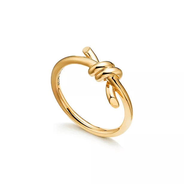 Tiffany Knot Ring — Yellow gold ring featuring the signature knot design; luxury jewelry for women.