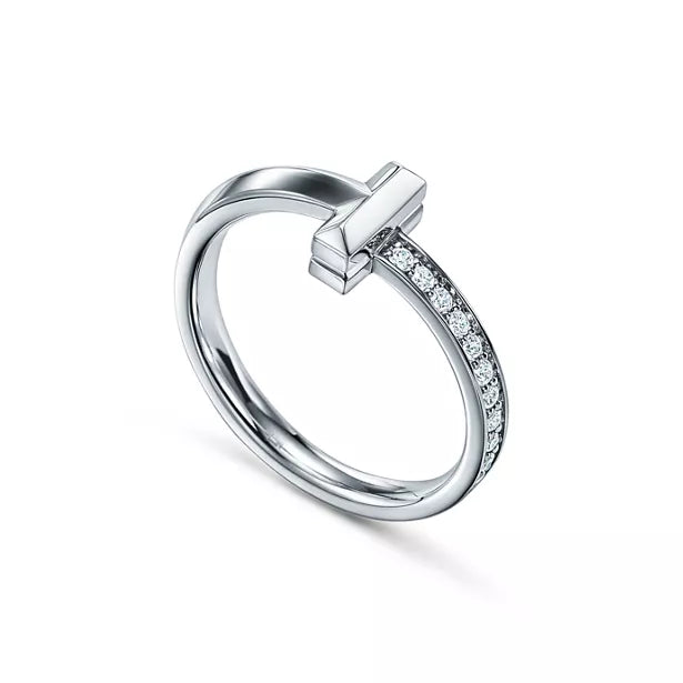 Tiffany T Diamond platinum band ring—featuring the iconic T motif.