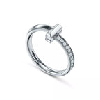 Tiffany T Diamond platinum band ring—featuring the iconic T motif.