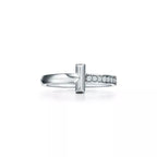 Tiffany T Diamond platinum band ring—featuring the iconic T motif.