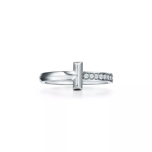 Tiffany T Diamond platinum band ring—featuring the iconic T motif.