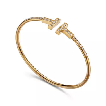 Tiffany T T1 Narrow Hinged Bangle in Yellow Gold—Modern Elegance and the Iconic Spirit of New York