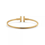 Tiffany T T1 Narrow Hinged Bangle in Yellow Gold—Modern Elegance and the Iconic Spirit of New York
