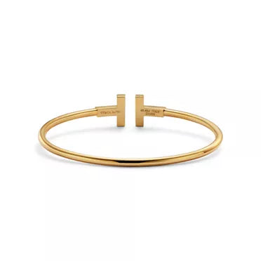 Tiffany T T1 Narrow Hinged Bangle in Yellow Gold—Modern Elegance and the Iconic Spirit of New York