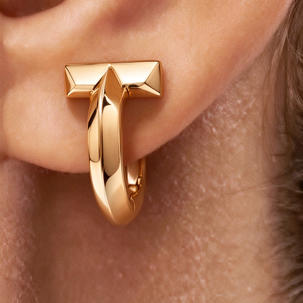 Tiffany T1 Gold Earrings — Iconic T-shaped hoop earrings | Luxury jewelry featuring a bold, minimalist geometric style