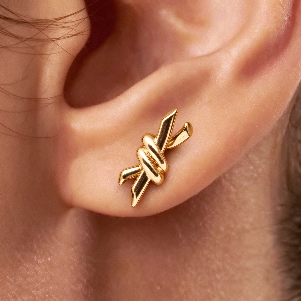 Tiffany Knot Small Gold Earrings—Hand-polished stud earrings featuring the signature organic knot design | Minimalist luxury gold jewelry
